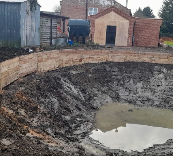 alt tag= the oak retaining wall taking shape